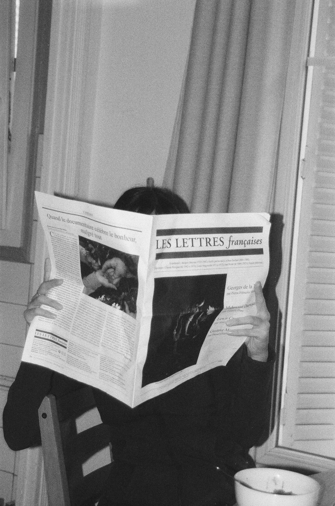 person reading newspaper