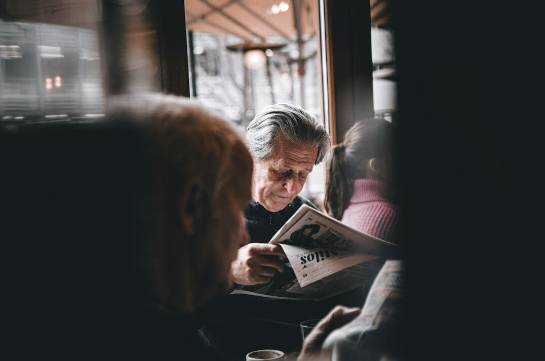 person reading newspaper