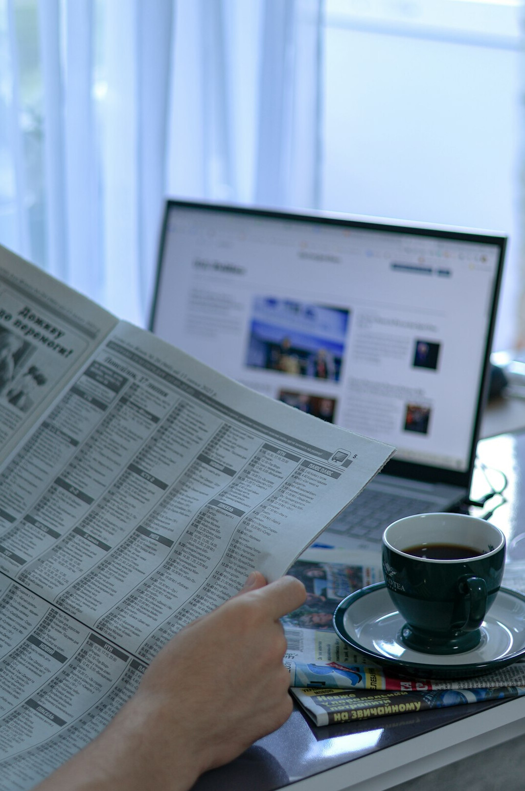 person reading newspaper